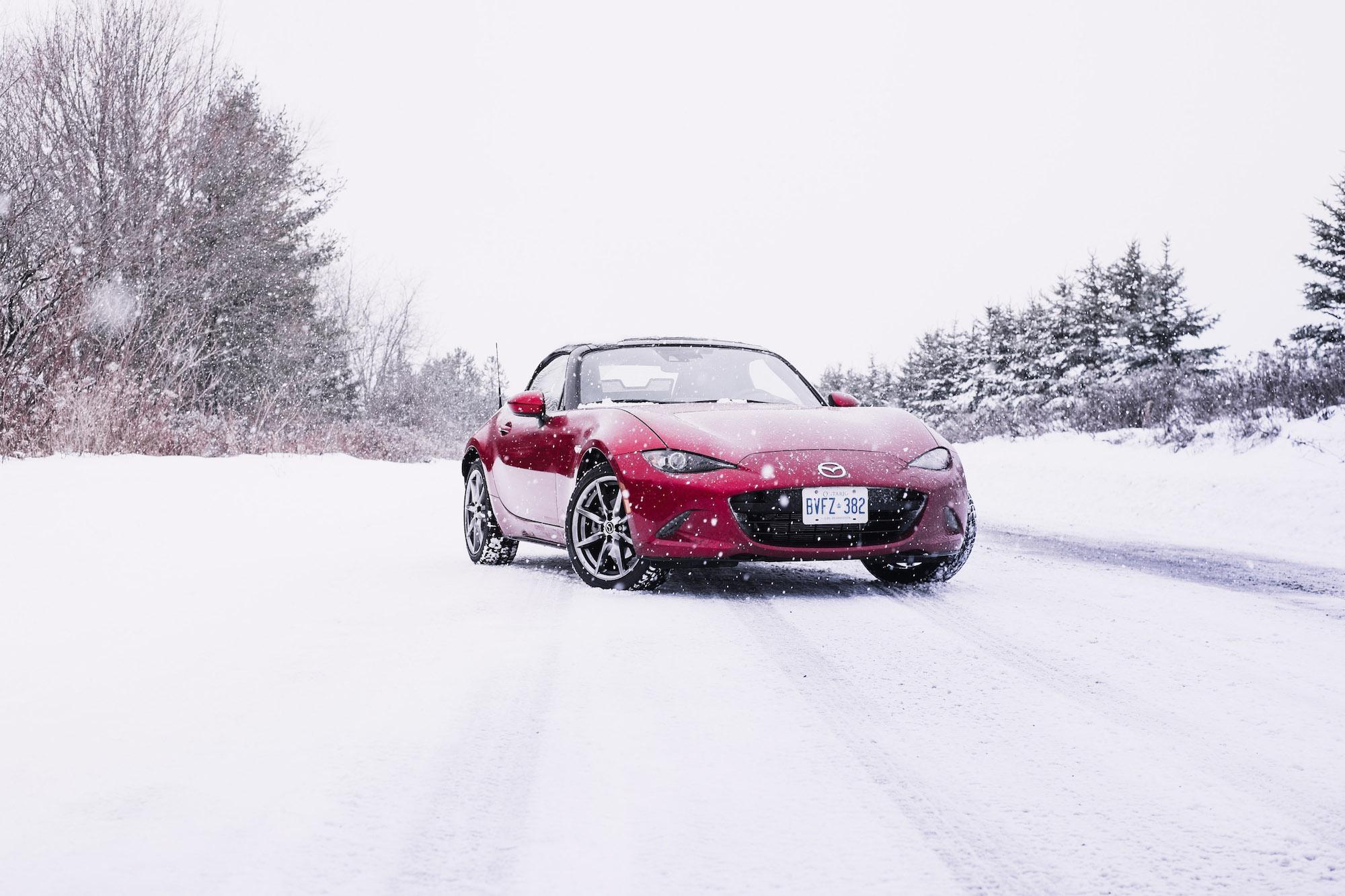 Red Mazda in the snow Red Mazda in the snow