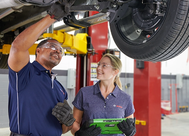 Bosch Auto Service technicians using the latest tools and technology to diagnose and repair a vehicle