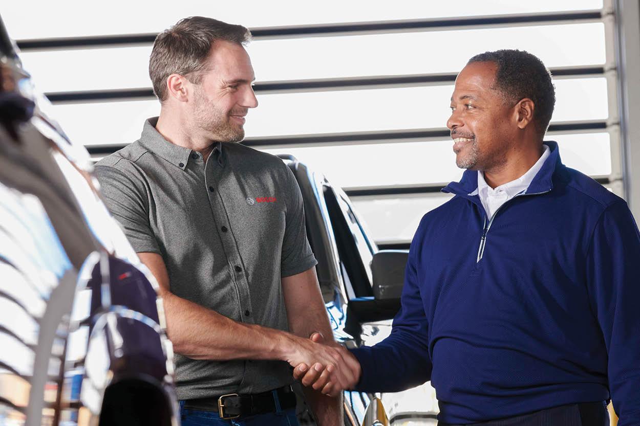 Bosch Auto Service Owner shaking hands with his the shop manager