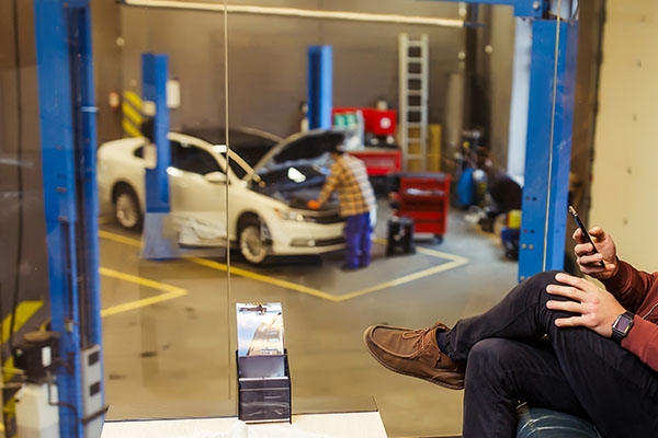Volkswagen Repair | Bosch Auto Service Volkswagen mechanic working on a car.