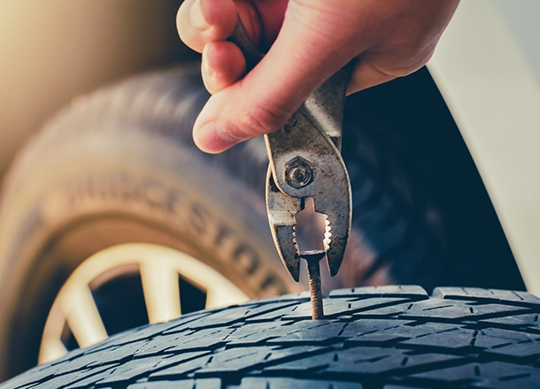 Bosch Auto Service | Technician Repairing a Tire Puncture