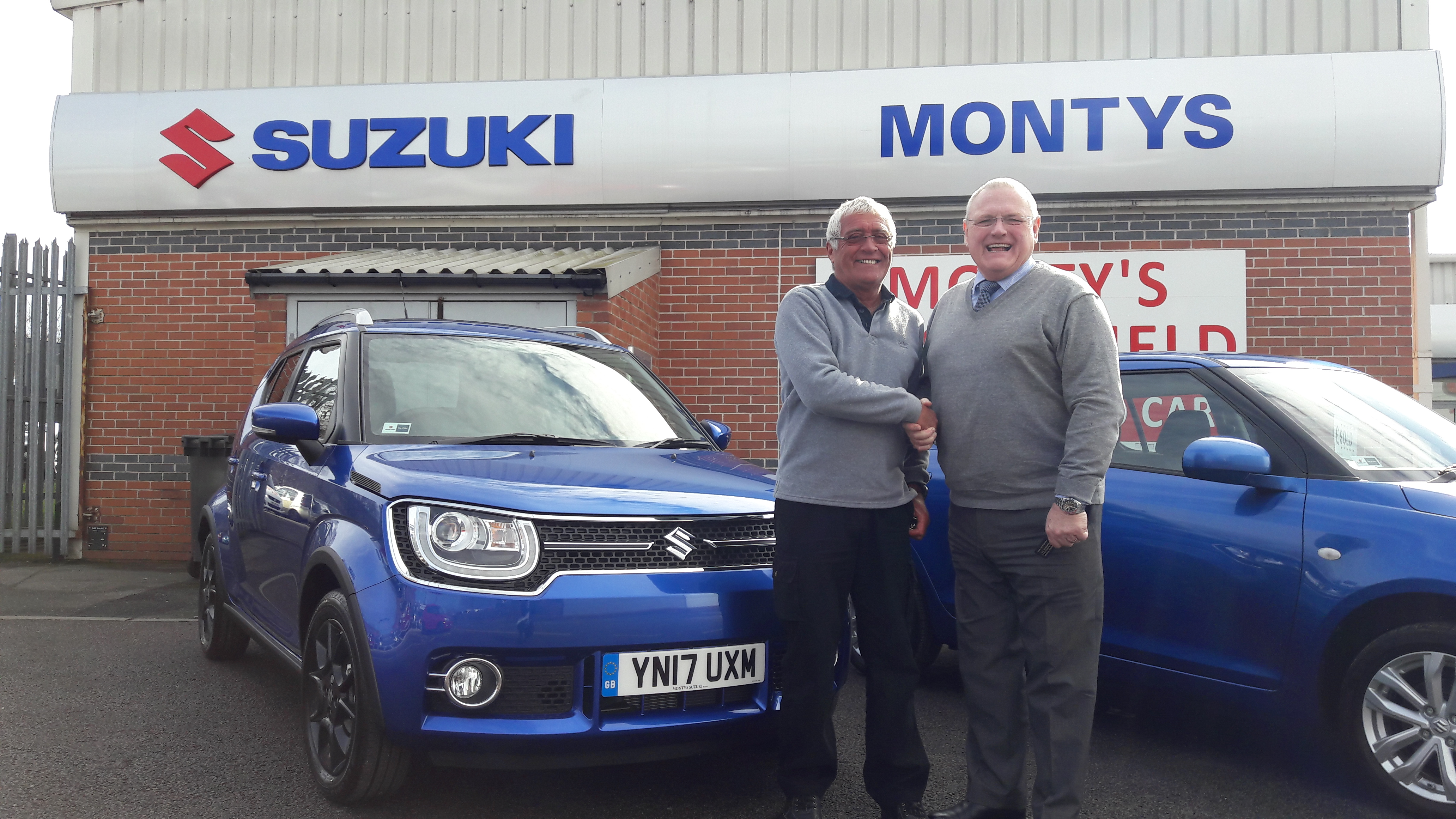Dr Morley collecting his 17 Plate Suzuki Ignis car
